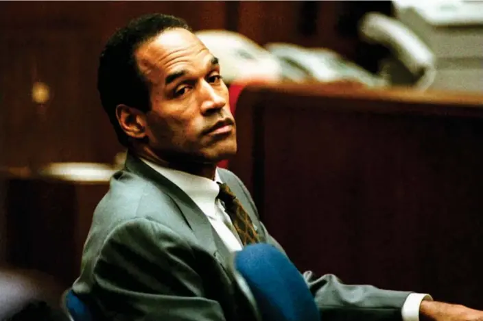  ?? Photograph: Pool via AFP - Getty Images ?? OJ Simpson sits in court in Los Angeles on 8 December 1994. The trial provided one of the most-watched popular culture events of the last century.