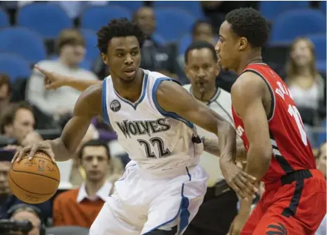  ?? JESSE JOHNSON/USA TODAY SPORTS ?? Timberwolv­es guard Andrew Wiggins looks for an outlet past the defence of the Raptors’ DeMar DeRozan on Wednesday night.