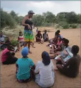  ?? Photo: Contribute­d ?? In the field... San learners being taught in an open area.