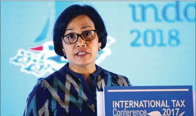  ?? BEAWIHARTA/REUTERS ?? KOMANDAN FISKAL: Sri Mulyani Indrawati dalam Joint IMF-Indonesia High Level Conference Internatio­nal Taxation in Asia di Jakarta kemarin.