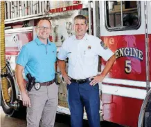  ?? [PHOTO PROVIDED BY MELINDA INFANTE] ?? Edmond Police Chief J.D. Younger, left, and Edmond Fire Chief Chris Goodwin are settling down in their new posts and using each other as a mini-support system.