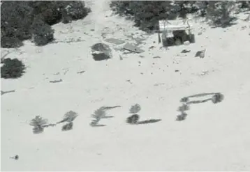  ?? U.S. COAST GUARD ?? Happy ending: A message is spelled out with palm fronds by three stranded fishermen Monday on Pikelot Atoll in Micronesia. The trio had embarked March 31 from Micronesia’s Pulawat Atoll, 100 miles away, but struck a coral reef. A U.S. Coast Guard ship picked them up Tuesday after the crew of a Navy plane spotted the sign from several thousand feet in the air.