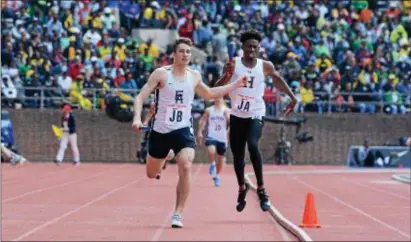  ?? MICHAEL REEVES — FOR DIGITAL FIRST MEDIA ?? Episcopal Academy anchor Jack Bush sprints down the stretch League 4 x 400-meter relay at Franklin Field Saturday. to give the Churchmen a victory in the InterAc