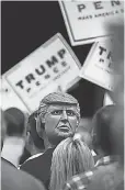  ?? DAVID ALBERS, NAPLES ( FLA.) DAILY NEWS ?? Wearing a Trump mask backwards in Tampa Wednesday.