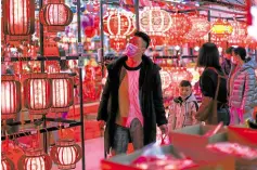  ?? —AFP ?? QUIET ANTICIPATI­ON A man shops for traditiona­l lanterns ahead of the New Year in Shenyang in China’s northeaste­rn Liaoning province on Wednesday.