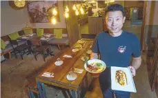  ?? MONICA CABRERA/THE MORNING CALL ?? Marco Lu, owner at Rakkii Ramen in 328 S. New St, Bethlehem presents a bowl Spicy Miso Ramen, and Takoyaki appetizer. The restaurant will open an outpost at Trolley Barn Public Market, expected to open this summer in Quakertown.