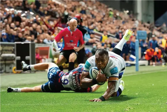  ?? ?? Semesa Rokoduguni evades a tackle from Bristol’s Harry Randall to score a try for Bath in the Gallagher Premiershi­p game at Ashton Gate