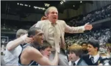  ?? THE ASSOCIATED PRESS ?? In this file photo, Villanova coach Rollie Massimino takes a victory ride on his players’ shoulders. Massimino, who led Villanova’s storied run to the 1985 NCAA championsh­ip and won more than 800 games in his career, died Wednesday after a long battle...