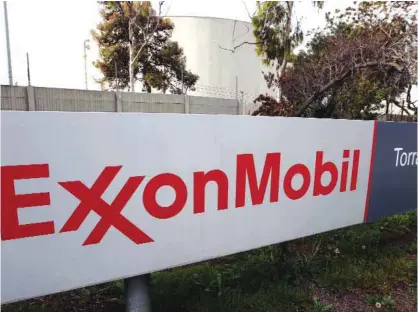  ?? —AP ?? This Jan 30, 2012, file photo shows the sign for the Exxon Mobil Torrance Refinery in Torrance, Calif. The Trump administra­tion denied a request from Exxon Mobil to waive US sanctions against Russia and allow it to resume oil drilling around the Black...