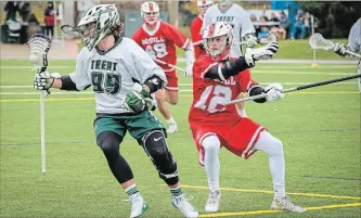  ?? ALYSSA CYMBALISTA SPECIAL TO THE EXAMINER ?? Trent’s Cole McWilliams (99) evades a defender as the Excalibur defeated the McGill Redmen 12-7 to clinch first place in the Canadian University Field Lacrosse Associatio­n's East Division Sunday afternoon .