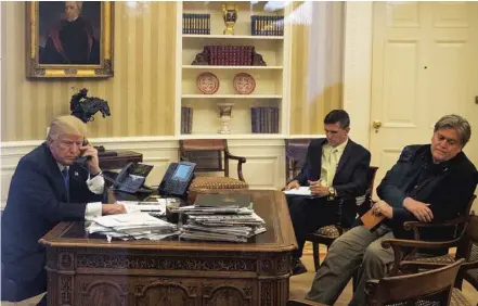  ??  ?? President Donald Trump in the Oval Office with chief strategist Steve Bannon, right