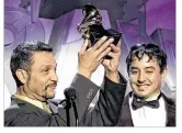  ?? MATT SAYLES / ASSOCIATED PRESS ?? Jose Galeano (left) and Mark Gonzales of Grupo Fantasma accept the award for best Latin rock, alternativ­e or urban album onstage during the pre-telecast of the 53rd annual Grammy
Awards in 2011.