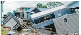  ?? EMILY KASK/THE NEW YORK TIMES ?? Damaged homes are shown after Hurricane Idalia passed in Horseshoe Beach on Wednesday.