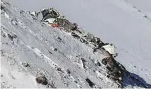  ?? AFP ?? The wreckage of Aseman Airlines flight EP3704 that crashed in Iran’s Zagros mountain range.