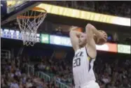  ?? RICK BOWMER — THE ASSOCIATED PRESS FILE ?? In this March 3photo, Utah Jazz forward Gordon Hayward goes up for a dunk against the Brooklyn Nets during NBA basketball game in Salt Lake City.