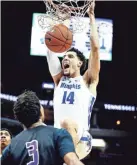  ?? MARK WEBER, THE COMMERCIAL APPEAL ?? Memphis forward Isaiah Maurice dunks over the LeMoyne-Owen defense during action of their exhibition game at the FedExForum.