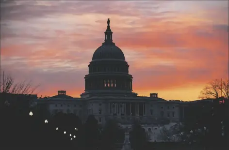  ?? ASSOCIATED PRESS ?? DAWN BREAKS AT THE
Capitol in Washington Monday.