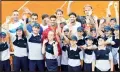  ??  ?? In this photo taken on June 12, 2020, Serbia’s Novak Djokovic, (centre), poses with volunteers and players during the Adria Tour charity tournament. Novak Djokovic’s parents have defended their son and blamed another tennis player for spreading the coronaviru­s at a series of exhibition matches hosted by the top-ranked player. Djokovic and his wife tested positive for the virus on June 23. Djokovic’s outspoken father blamed the cancellati­on of the Adria Tour on Grigor Dimitrov. (AP)