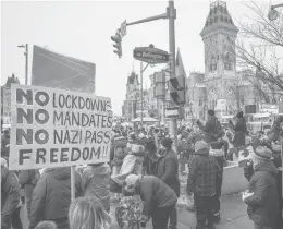  ?? BRETT GUNDLOCK/THE NEW YORK TIMES ?? Protesters gather Friday in Ottawa, Ontario, where they are demanding an end to vaccine mandates and coronaviru­s restrictio­ns.