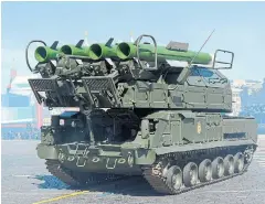  ?? YURI KADOBNOV AFP/GETTY IMAGES ?? A Russian air defence Buk-2M armoured launcher vehicle is the weapon found to be responsibl­e for the downing of the Malaysian passenger jet.