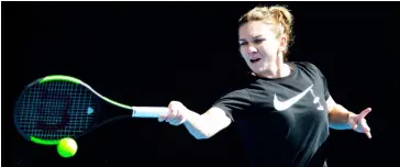  ??  ?? Simona Halep plays a forehand shot during a practice session in Melbourne. — AFP photo