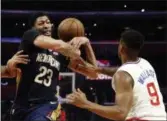  ?? RINGO H.W. CHIU — THE ASSOCIATED PRESS ?? New Orleans Pelicans’ Anthony Davis, left, gets fouled by Los Angeles Clippers’ Tyrone Wallace during a game on Jan. 14.