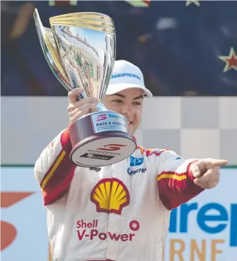  ??  ?? Scott McLaughlin celebrates his win in race 4 at Albert Park in Melbourne.