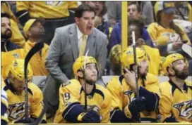  ?? MARK HUMPHREY — THE ASSOCIATED PRESS ?? Former Flyers coach Peter Laviolette argues a call during period against the Blues Sunday in Nashville, Tenn. the first