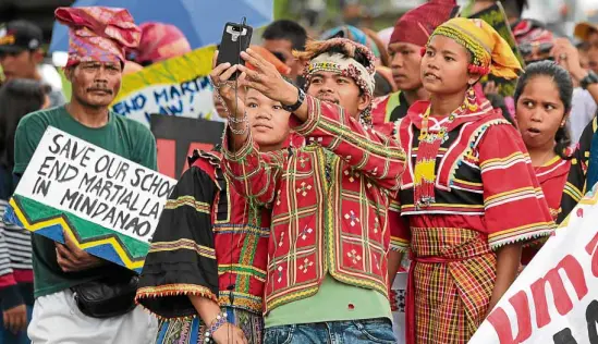  ?? —GRIG C. MONTEGRAND­E ?? ‘RED OCTOBER’ Under the military version of the plot to oust President Duterte, gatherings like this on Sept. 23 by “lumad” groups in Quezon City could be considered part of the campaign to remove the President.