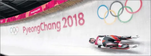  ?? THE CANADIAN PRESS/NATHAN DENETTE ?? Kimberley Mcrae of Canada competes in heat two of women’s single luge during the 2018 Olympic Winter Games in Pyeongchan­g, South Korea, Monday.