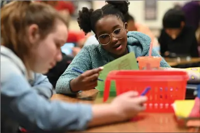  ?? COURTESY OF SAN FRANCISCO FILM FESTIVAL ?? Students tackle math assignment­s in Sausalito filmmaker Vicki Abeles' “Counted Out,” a film that seeks to demystify aspects of mathematic­s.