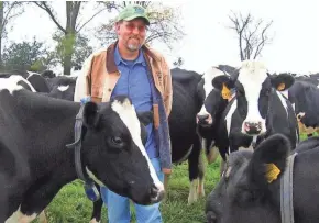  ?? ORGANIC VALLEY ?? Organic Valley's lead veterinari­an, Guy Jodarski, educates farmers about more sustainabl­e practices, including how to graze animals to reduce their carbon footprint.