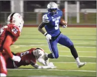  ?? Pete Paguaga / Hearst Connecticu­t Media ?? West Haven’s Amir Nakome runs the ball against Fairfield Prep on Thanksgivi­ng Eve.