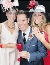  ??  ?? Deighton Cup co-founder Dax Droski raised a glass of Piper-Heidsieck champagne to toast Kylie Pasutto and Deanna Leystra’s floral millinery.