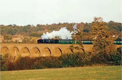  ?? STEVE KNIGHT/CREATIVE COMMONS ?? Right: Bulleid Merchant Navy 4-6-2 No. 35005 Canadian Pacific crosses Chappel Viaduct with ‘The Alresford Adventurer’ charter over the Sudbury branch on November 4, 2001.