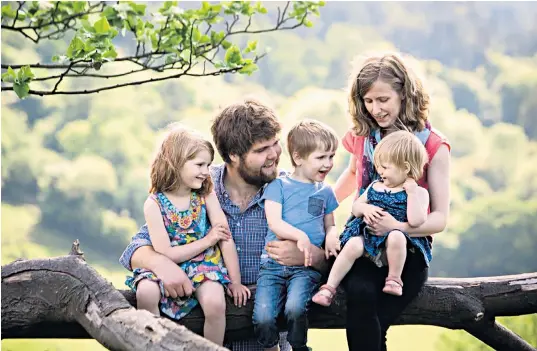  ??  ?? Zoe Powell, who died in the crash with Phoebe, eight, Simeon, six, and Amelia, four. Her husband Joshua, also pictured, and their youngest child, an 18-monthold girl, are in a critical condition in hospital. Above, police appeal for witnesses to the crash on the A40 near Oxford