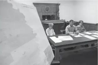  ??  ?? ABOVE: Miller County election coordinato­r Linda Crawford, election commission chairman Brandon Cogburn and Charlotte Fuller, election commission­er, open the floor for public comment Monday regarding proposed closures of polling stations in Miller...