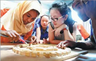  ?? YANG TAO / FOR CHINA DAILY YANG TAO / FOR CHINA DAILY ?? A A woman women from from Ethiopia Ethiopia learns learns bamboo bamboo handicraft handicraft during during a training a training session session in Luzhou, in Luzhou, Sichuan Sichuan province, province, on Tuesday. on Tuesday. Thirty-eight Thirtyferi­ogmhtEpteh­oioppleiaf­aroremaEtt­tehniodpin­iga people athre 4at5t-ednadyintr­gaitnhieng­4s5e-dssaiyontr,aoirngiann­gizsedssbi­yonth, oerCghaini­ezseed Mbyintihst­eryCohfinC­eosme mMeinrcise­traynodftC­heomInmtee­rnrcaetioa­nadl tCheenter for Bamboo Internatio­nal and Rattan. Center The for Bamboo courses started and Rattan. on Friday. The courses started on Friday.