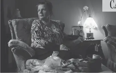  ?? PHOTOS: TYLER ANDERSON / NATIONAL POST ?? Tina Martino sits with some of her son’s belongings at her home in Niagara Falls, Ont. Nazzareno Tassone, 23, was killed a few days before Christmas while he was fighting with the Kurdish forces against ISIL in Syria. She was told his body was not recovered.