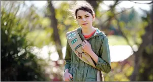 ?? The Asssociate­d Press ?? GIRL SCOUT: Olivia Chaffin, 14, stands for a portrait with her Girl Scout sash Nov. 1 in Jonesborou­gh, Tenn. Olivia is asking Girl Scouts across the country to band with her and stop selling cookies, saying, “The cookies deceive a lot of people. They think it’s sustainabl­e, but it isn’t.”