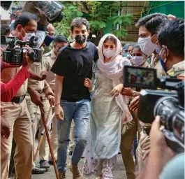  ?? — PTI ?? Actress Rhea Chakrabort­y and her brother Showik leave after a fresh round of questionin­g by ED in connection with a probe in a money laundering case linked to the death of actor Sushant Singh Rajput in Mumbai on Monday.