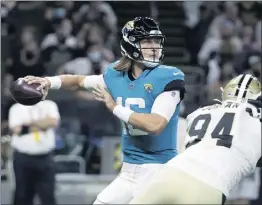  ?? DERICK HINGLE — THE ASSOCIATED PRESS ?? Jacksonvil­le quarterbac­k Trevor Lawrence, the top overall pick in this year’s draft, was selected by Jaguars coach Urban Meyer to start in the Sept. 12opener against Houston.