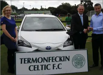  ??  ?? John Malone and Donna Lambe of Malone’s Toyota present the keys of a car to Alan Fitzpatric­k, chairman of Termonfeck­in Celtic FC.