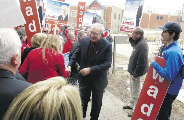  ?? Jake Edmiston / National Post ?? P.E.I. Liberal party Leader Wade MacLauchla­n greets supporters at the University of Prince Edward Island, where he was formerly president.