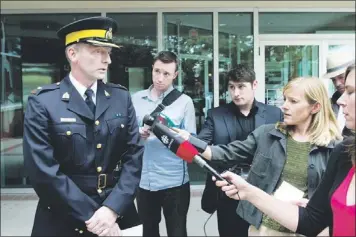  ?? — Photo by The Canadian Press ?? RCMP Insp. Garrett Woolsey addresses a news conference in Calgary, Alta., Saturday where he announced RCMP in southern Alberta have charged a man with murder in connection with the death of a retired Mountie who was working as a peace officer.