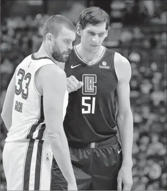  ?? Brandon Dill Associated Press ?? GRIZZLIES CENTER Marc Gasol, left, is 7 feet 1, but he is clearly shorter than the Clippers’ Boban Marjanovic, who scored 19 points. “He’s 7-8,” Memphis’ Jaren Jackson Jr. said of Marjanovic.