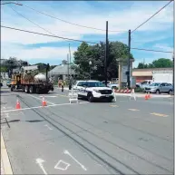  ?? By Peter Yankowski / Hearst Connecticu­t Media ?? A sinkhole prompted the closure of Greenwood Avenue in Bethel and disrupted Metro-North Thursday. Workers said they expected to be able to reopen the area Monday.