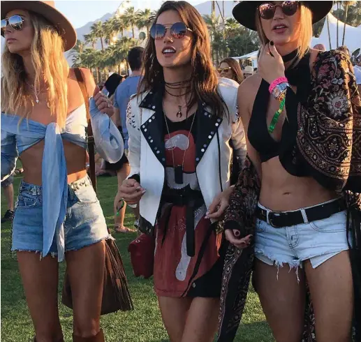  ?? ?? Model Alessandra Ambroisio (center) and friends embodied the 2010s festival look.