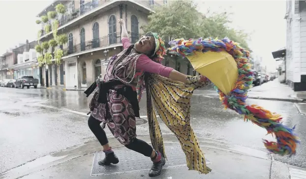  ?? PICTURE: GETTY IMAGES ?? 0 There was dancing in the French Quarter of New Orleans as the city was spared the most ferocious winds and storm surges