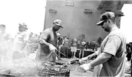  ?? BRENNEN EASTER/U.S. NAVY ?? Sailors have a “steel beach picnic” early this month on the flight deck of the aircraft carrier USS Dwight D. Eisenhower, which has been at sea since January.